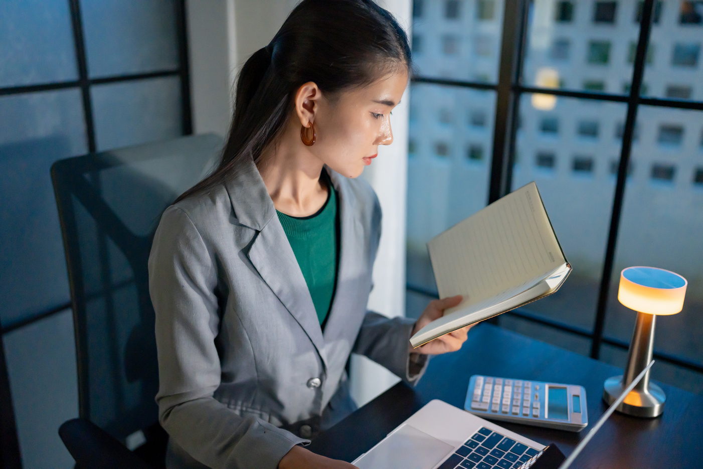 Woman working late at desk